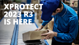 image of worker taking package off of a conveyor belt